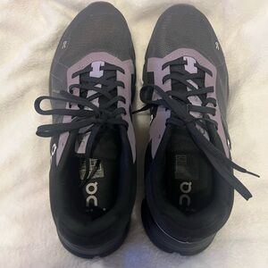 Mens size 9 On Running Black Sneakers with purple accent!